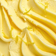 Swirls of pale yellow ice cream with citrus zest detail