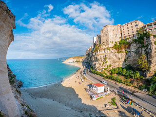 Tropea Calabria Italy. Cliffside town above turquoise sea, sunny beach, historic buildings on limestone, vibrant summer colors.