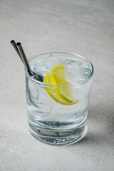 A cool drink with ice and lemon slices awaits enjoyment, perfect for a warm day