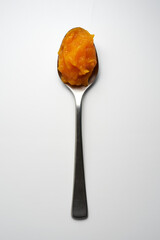 Spoon with pumpkin puree. top view