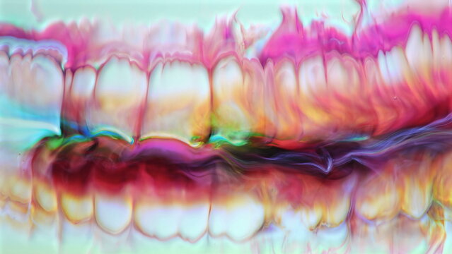 Vibrant abstract acrylic paint creating organic flowing color patterns