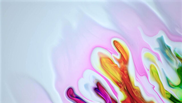 Colorful vibrant liquid art with flowing paint mixing smoothly