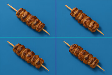 four Souvlaki on Blue Background - Feels like an image inserted in a magazine