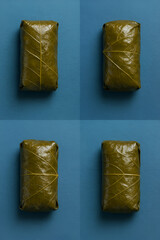 four Dolmades on Blue Background - Feels like an image inserted in a magazine
