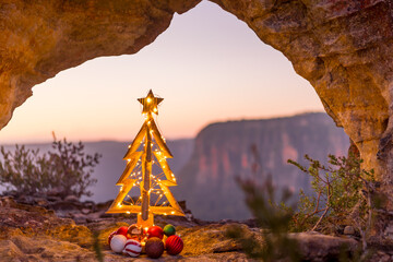 Blue Mountains Christmas festive tree and cliff backdrop