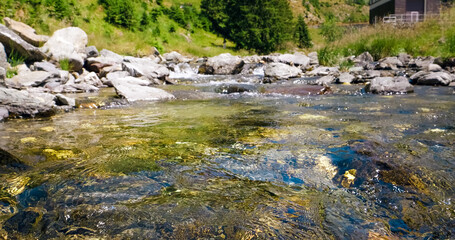 Water flowing in a mountain river rushing down.