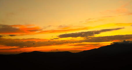 Obraz premium Sunset cloudy sky with fluffy clouds at night.