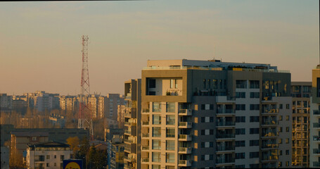 Bucharest cityscape view from building rooftops at sunset