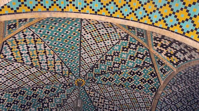 Colorful mosaic dome design minaret mosque with arch tiles in turquoise blue yellow pattern medieval Islamic architecture ancient landmark UNESCO destination Iran Uzbekistan travel wonder religion art