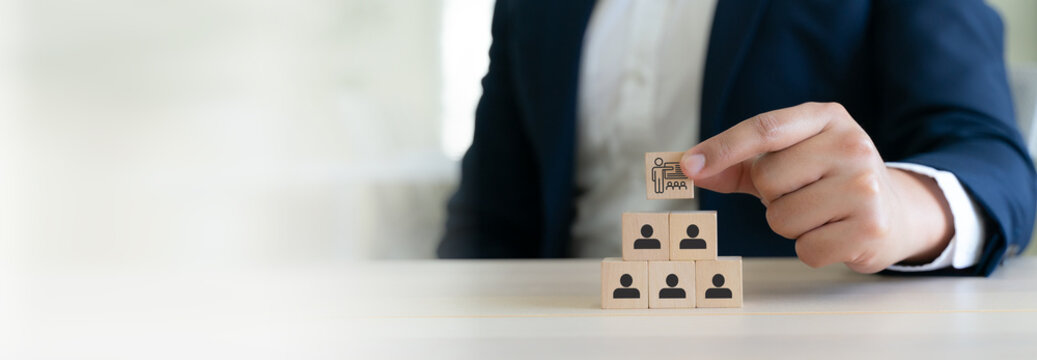 Training and Workforce Development. Wooden blocks with training  and human icons, symbolizing structured learning, skill development and leadership driven training programs. Learning management system