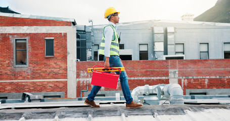 Man, electrician and walk with toolbox on roof for maintenance, ac repair and installation. Male person, inspection and gear for air conditioning services, hvac troubleshooting and quality assurance