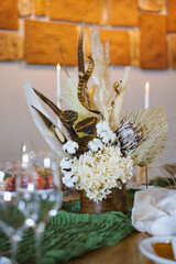 Unique floral arrangement on a dining table setting