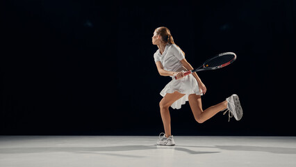 Female tennis player performing backhand in white uniform. Concept of sports biomechanics, movement analysis, dynamic balance in professional coaching, and rehabilitation study.