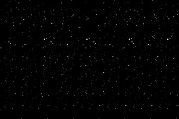 Snow falling, starry night sky