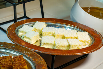 Karisik Turk tatlilari. New dessert varieties at the  luxury hotel open buffet. Milk-based desserts,  Turkish Dessert Sobiyet, havuc dilimi, midye baklava, mussels baklava and classic baklava. 