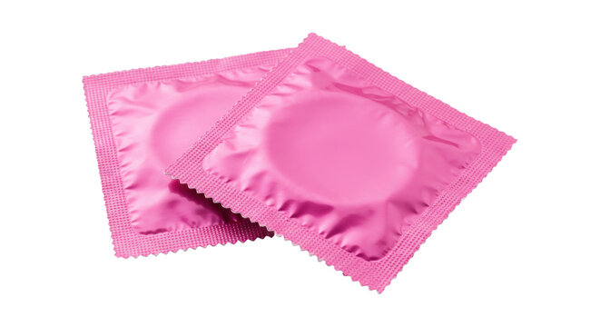 Pair of pink condom wrappers overlapping on a transparent background for safe sex