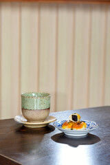 Hot Matcha green tea cup with Chinese pastry