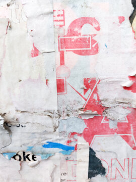 Old torn and ripped street poster background, weathered and messy paper texture