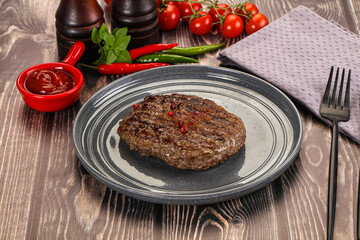 Grilled beef burger cutlet with sauce