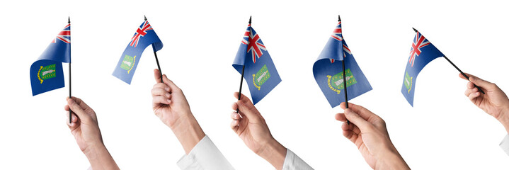 The British Virgin Islands flag in hand in different angles on a white background