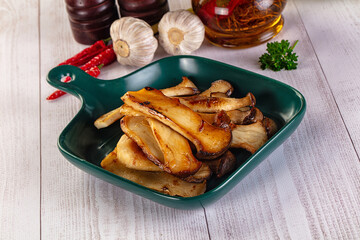 Roasted eringi mushrooms in the plate