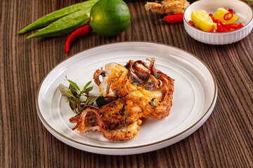 Gourmet grilled whole octopus served lime