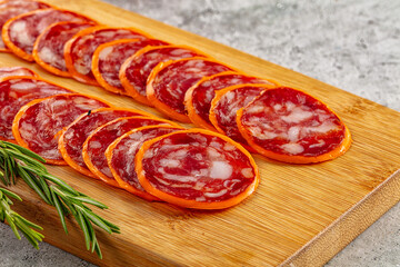 Spicy salami sausage in the cheese