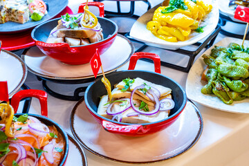Mediterranean cuisine, olive oil, healthy and delicious  salad varieties with green vegetables.Vegetarian and vegan healty food, open buffet in a luxury hotel. Meze varieties, salad bar.