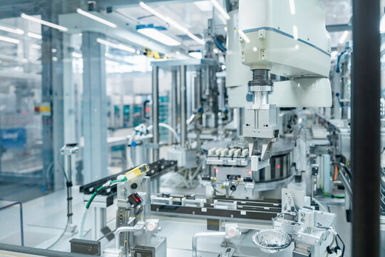 Automated industrial robot machinery in modern factory interior