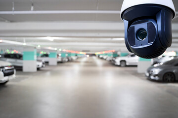 Security CCTV camera monitoring indoor parking garage for safety, surveillance, protection and...