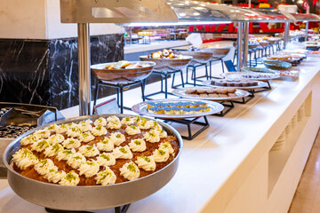 Karisik Turk tatlilari. New dessert varieties at the  luxury hotel open buffet. Milk-based desserts,  Turkish Dessert Sobiyet, havuc dilimi, midye baklava, mussels baklava and classic baklava. 