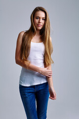 Sustainability, denim or portrait of woman in studio for brand marketing, recycle material or eco friendly retail. Grey background, smile or model with blue jeans, green fashion promotion or space