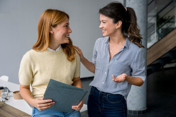 Confident woman discussing business in a modern office setting