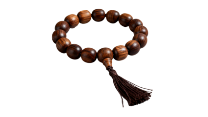 A close-up shot of a traditional wooden beaded bracelet with a dark brown tassel, often used as prayer beads or mala.