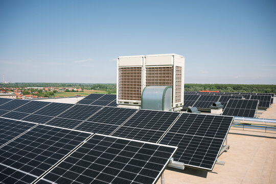 Solar panels on urban rooftop for sustainable renewable energy