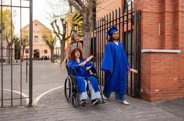 Young woman in cap and gown with diploma leaving university campus after graduation