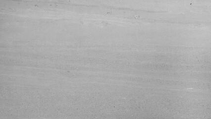 Light gray stone texture with subtle horizontal lines, smooth surface, and natural pattern, ideal for background, wall, or flooring design in modern architecture