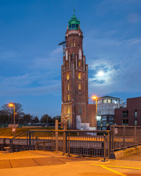 Simon Loschen Tower lighthouse illuminated at night in Bremerhaven Germany