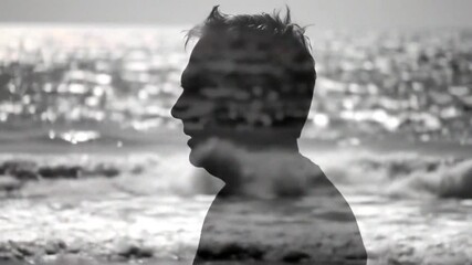 A serene silhouette merges with ocean waves, evoking contemplation and tranquility in a dreamlike setting.