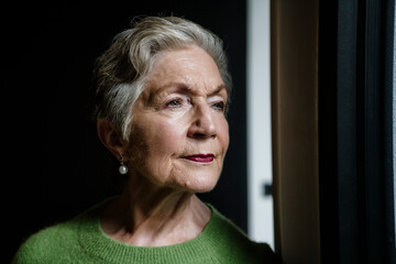 Entrepreneur enjoying a relaxing moment by the window indoors