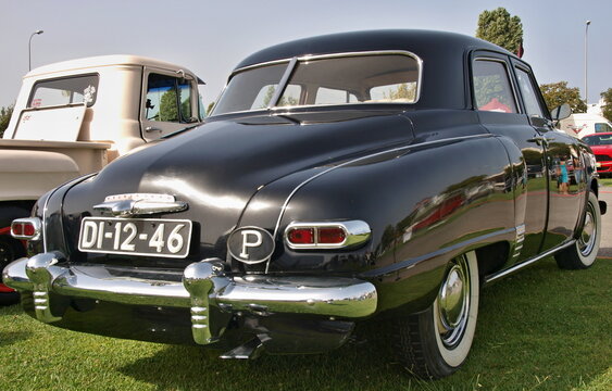 Studebaker Champion black vintage sedan parked on grass