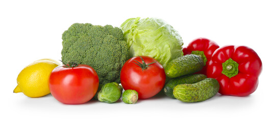 Pile of different fresh raw vegetables and lemon isolated on white