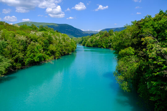 Scenic River Isonzo flowing through lush landscape at Ponte di Piuma