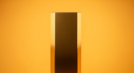 A sleek, vertical golden bar with polished, reflective edges stands against a vibrant orange and yellow gradient background.