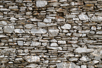 Stone walls of historical buildings. Stone walls of old wooden buildings. Stone-built architecture. Stone walls of historical Birgi houses in the &Ouml;demiş district. T&uuml;rkiye.