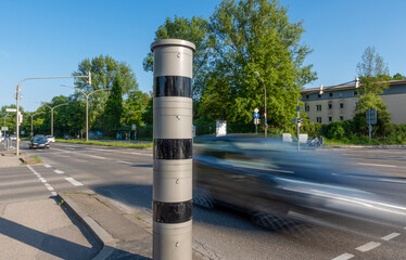 Modern speed camera monitoring traffic with motion blur in Augsburg, Bavaria