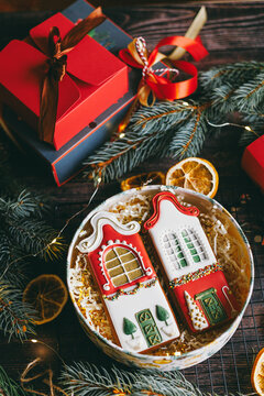 Homemade decorated gingerbread cookies as Christmas gift with festive packaging