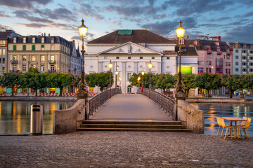 Lucerne, Switzerland - View of Rathaussteg bridge and building of Luzerner Theater on sunrise