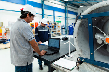 Engineers working in a workshop on renewable energy projects