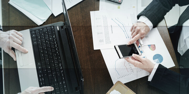 Businesspeople working together, geometric pattern